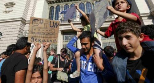 不堪难民涌入压力匈牙利国防部长宣布辞职（图）